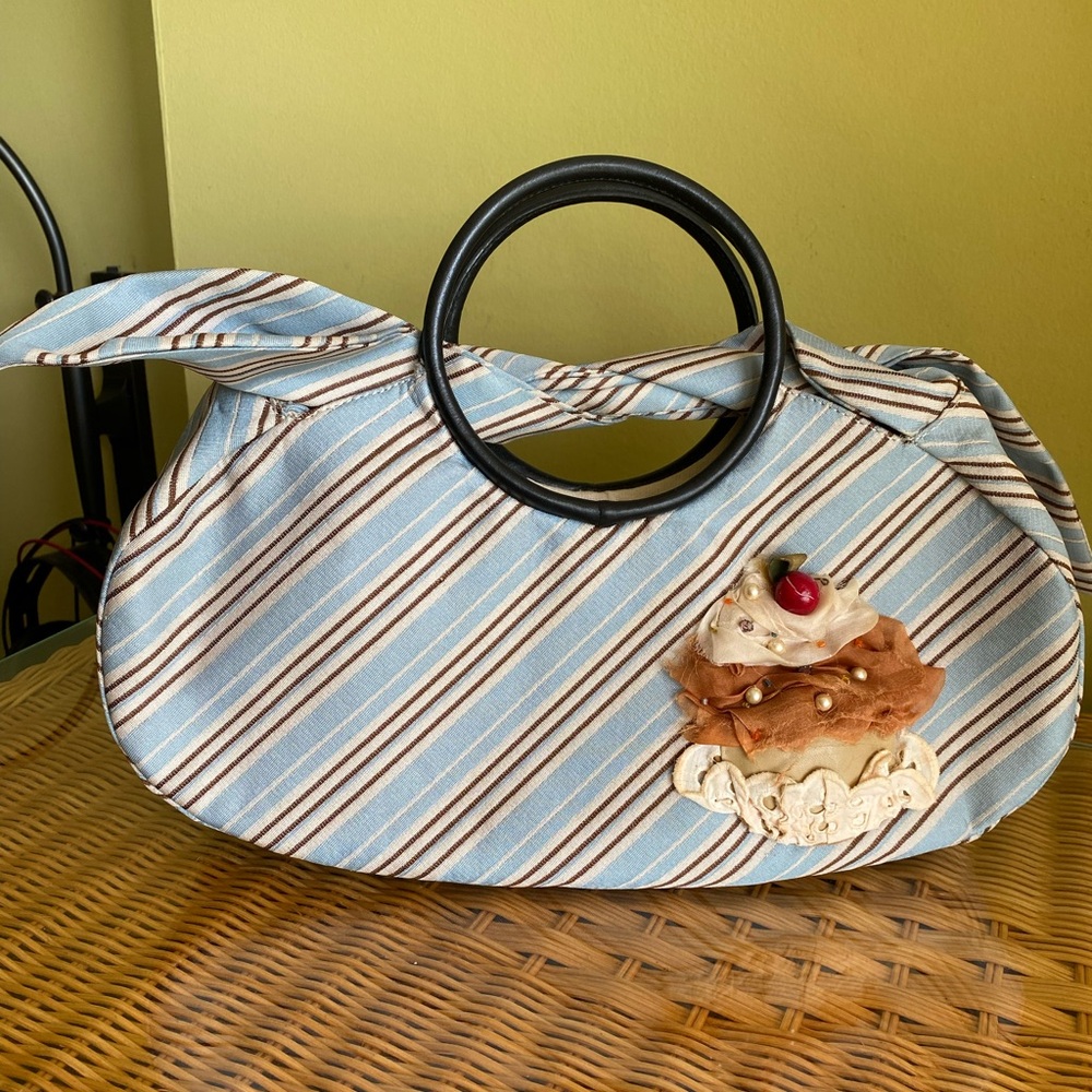 Chic Blue Shoulder Bag With Modern Circular Handle